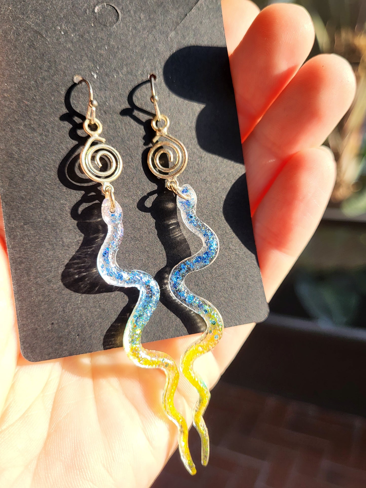 Blue and Yellow Resin Snake Earrings With Swirl Charm