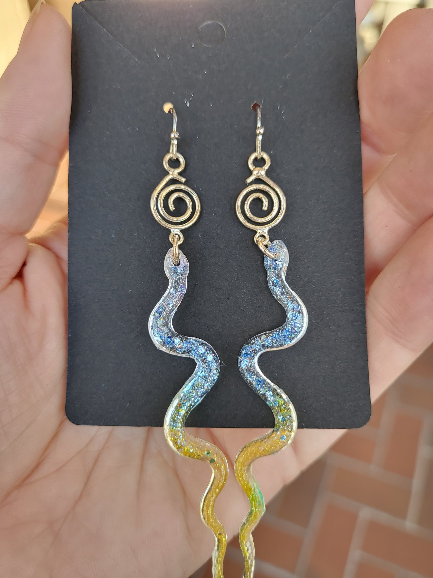 Blue and Yellow Resin Snake Earrings With Swirl Charm