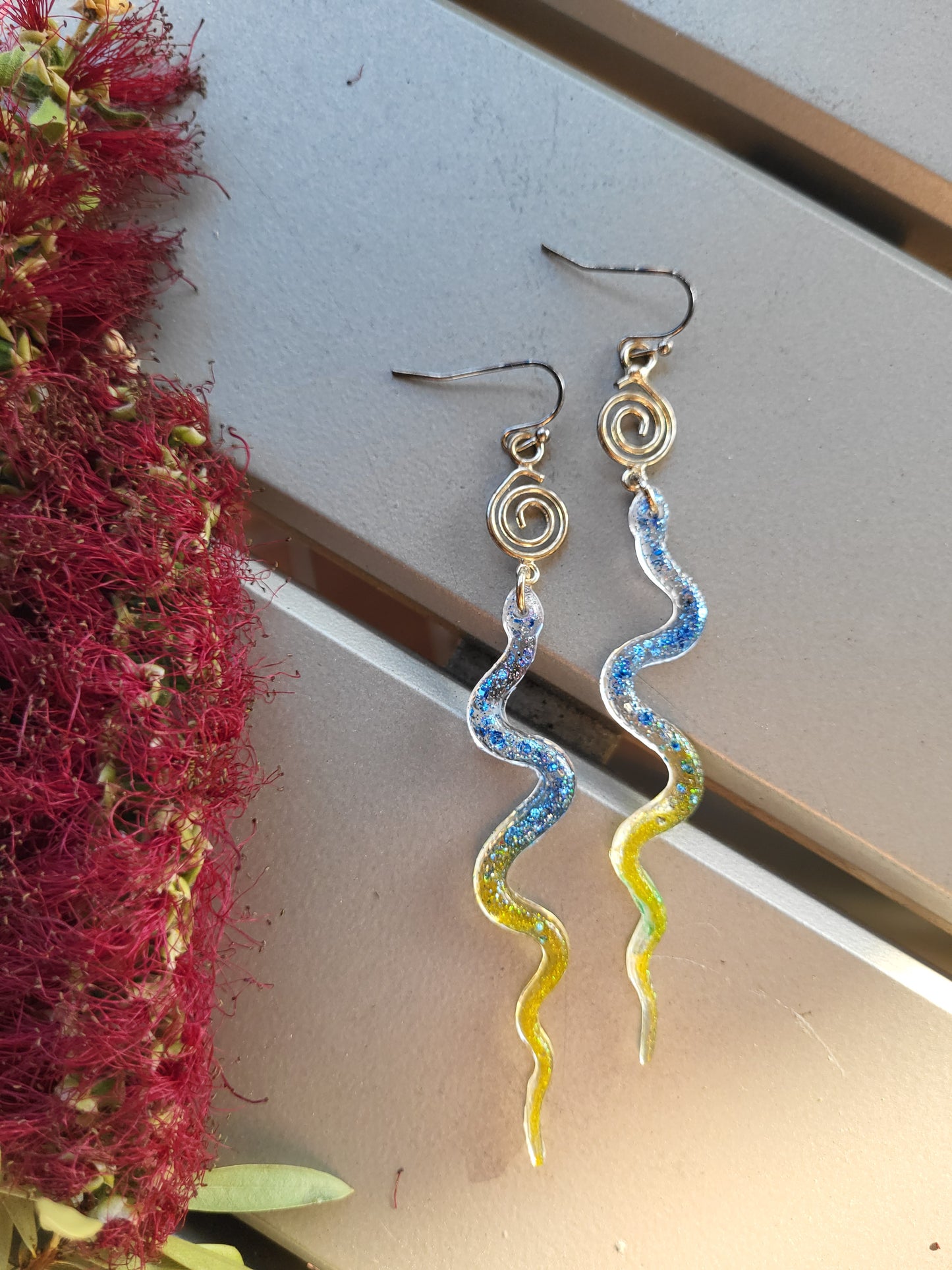 Blue and Yellow Resin Snake Earrings With Swirl Charm