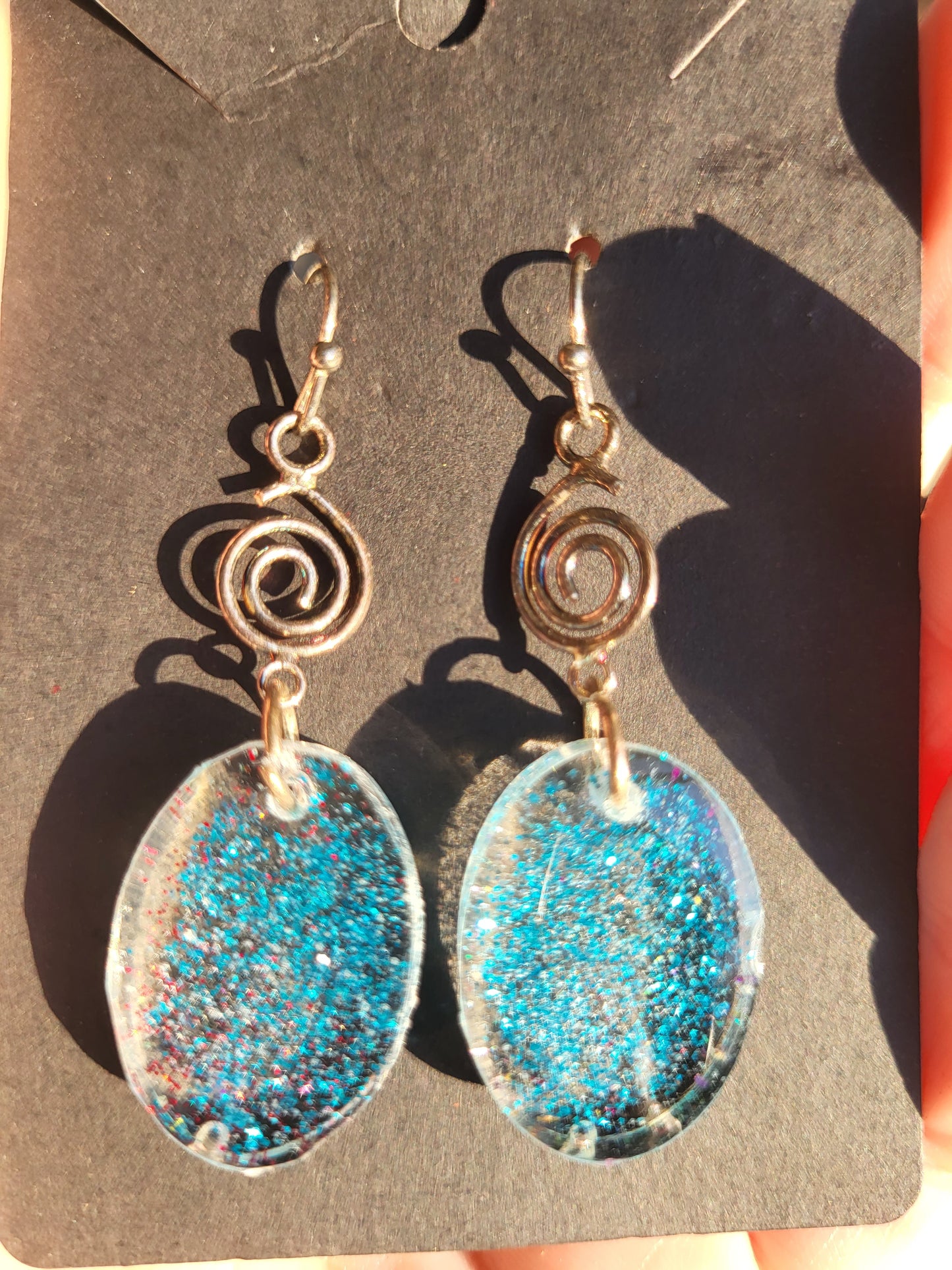 Blue Resin Oval Hook Earrings With Swirl Charm