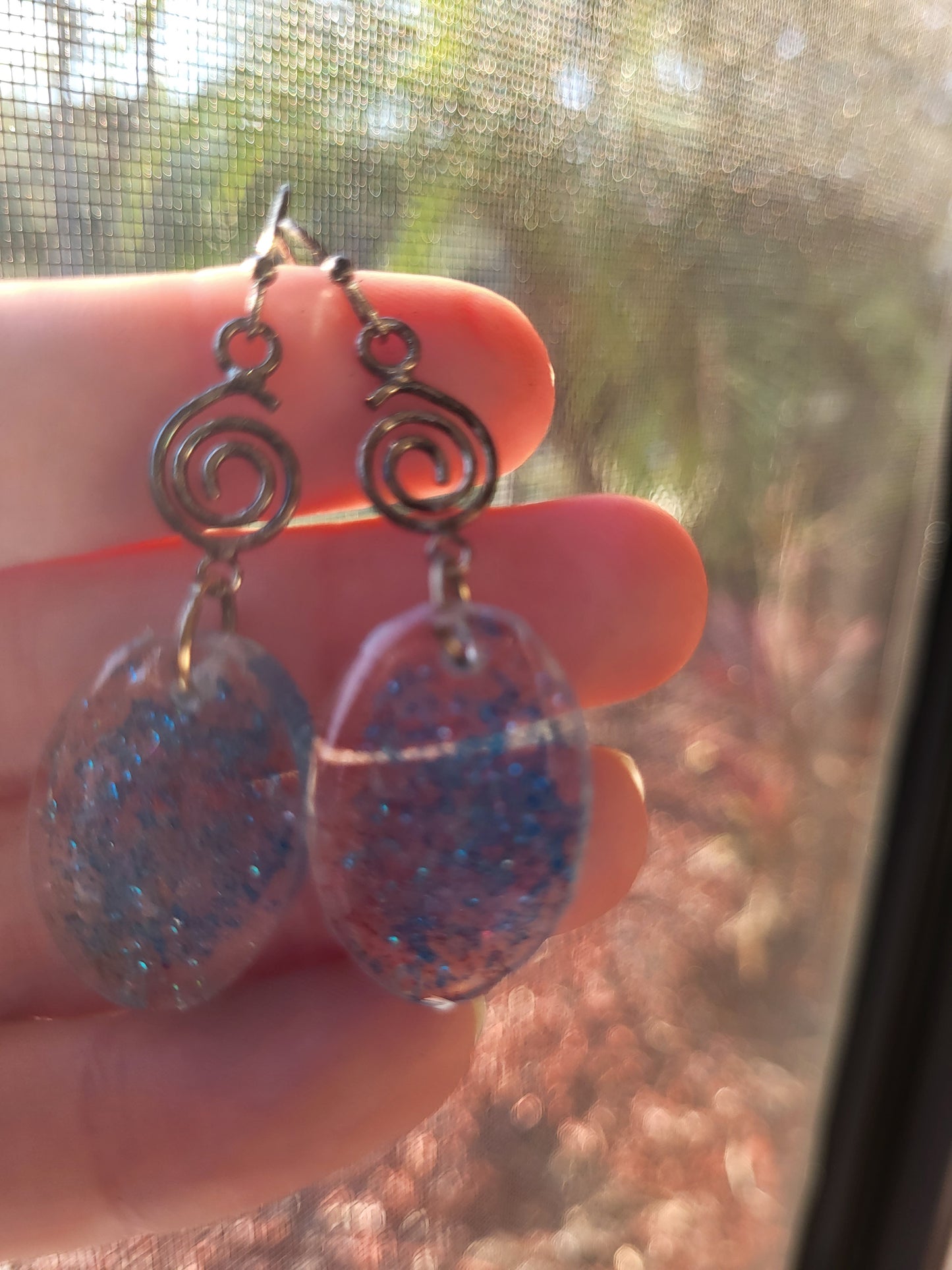 Blue Resin Oval Hook Earrings With Swirl Charm