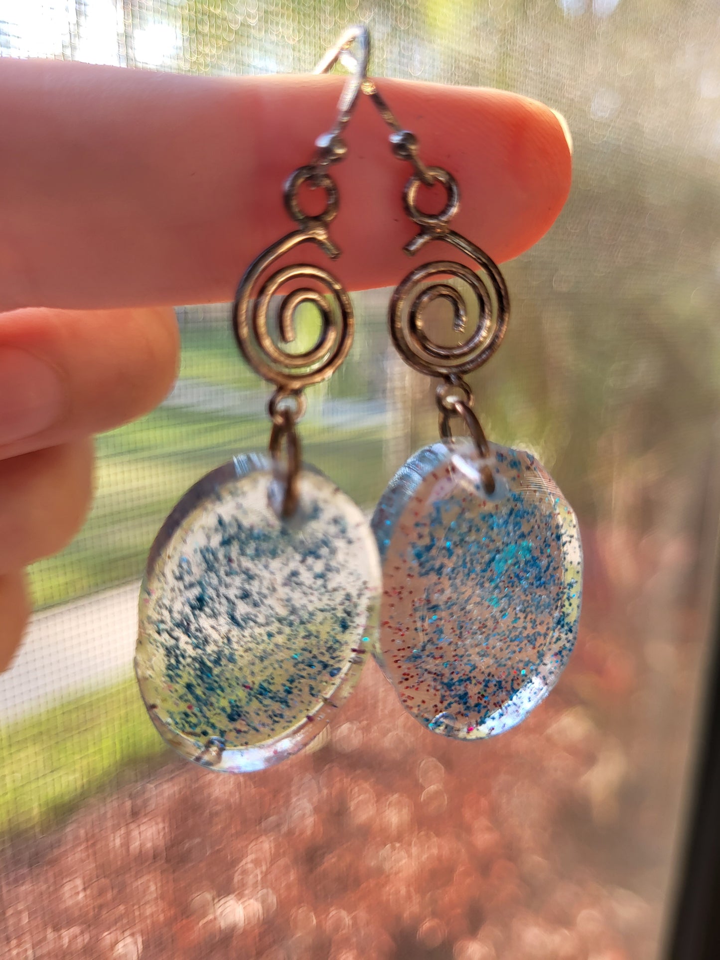 Blue Resin Oval Hook Earrings With Swirl Charm