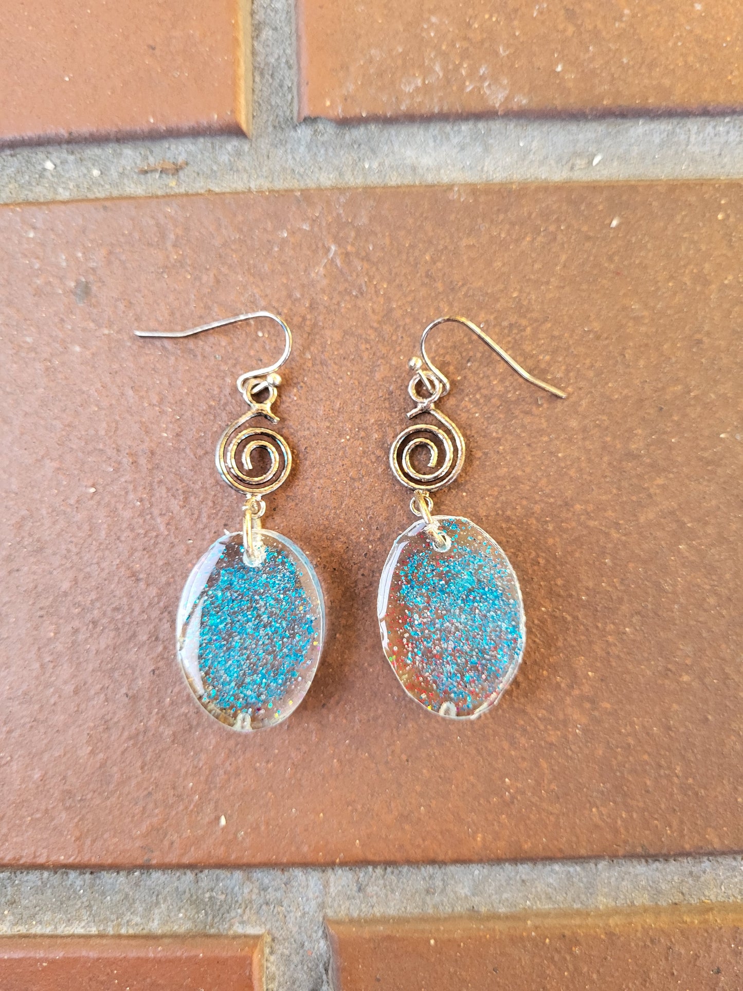 Blue Resin Oval Hook Earrings With Swirl Charm