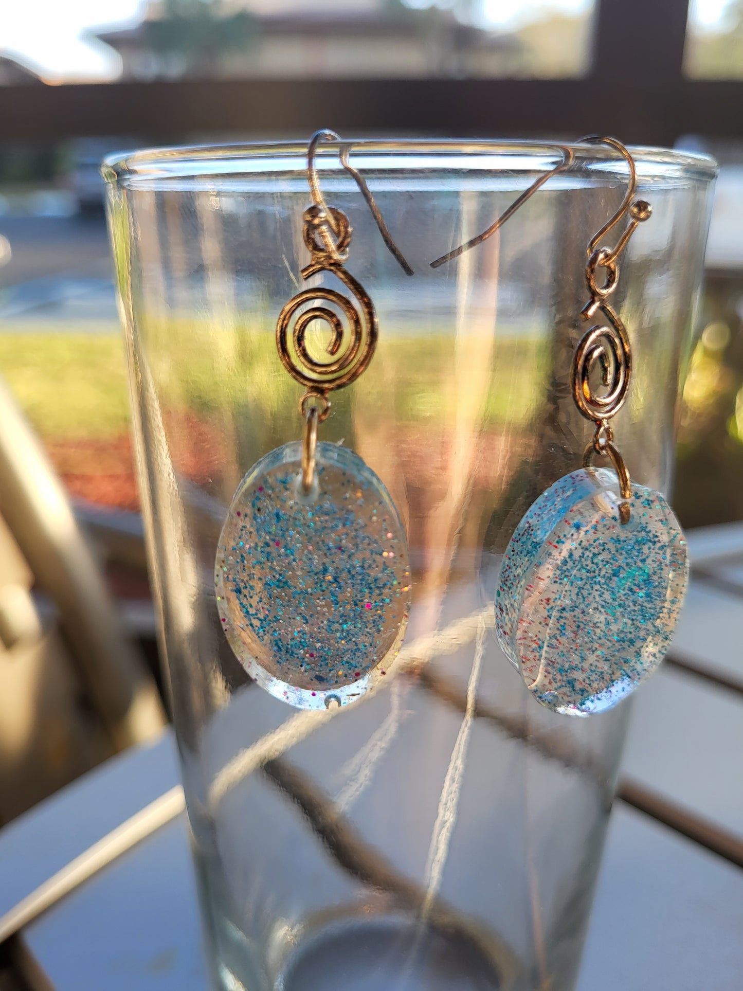 Blue Resin Oval Hook Earrings With Swirl Charm