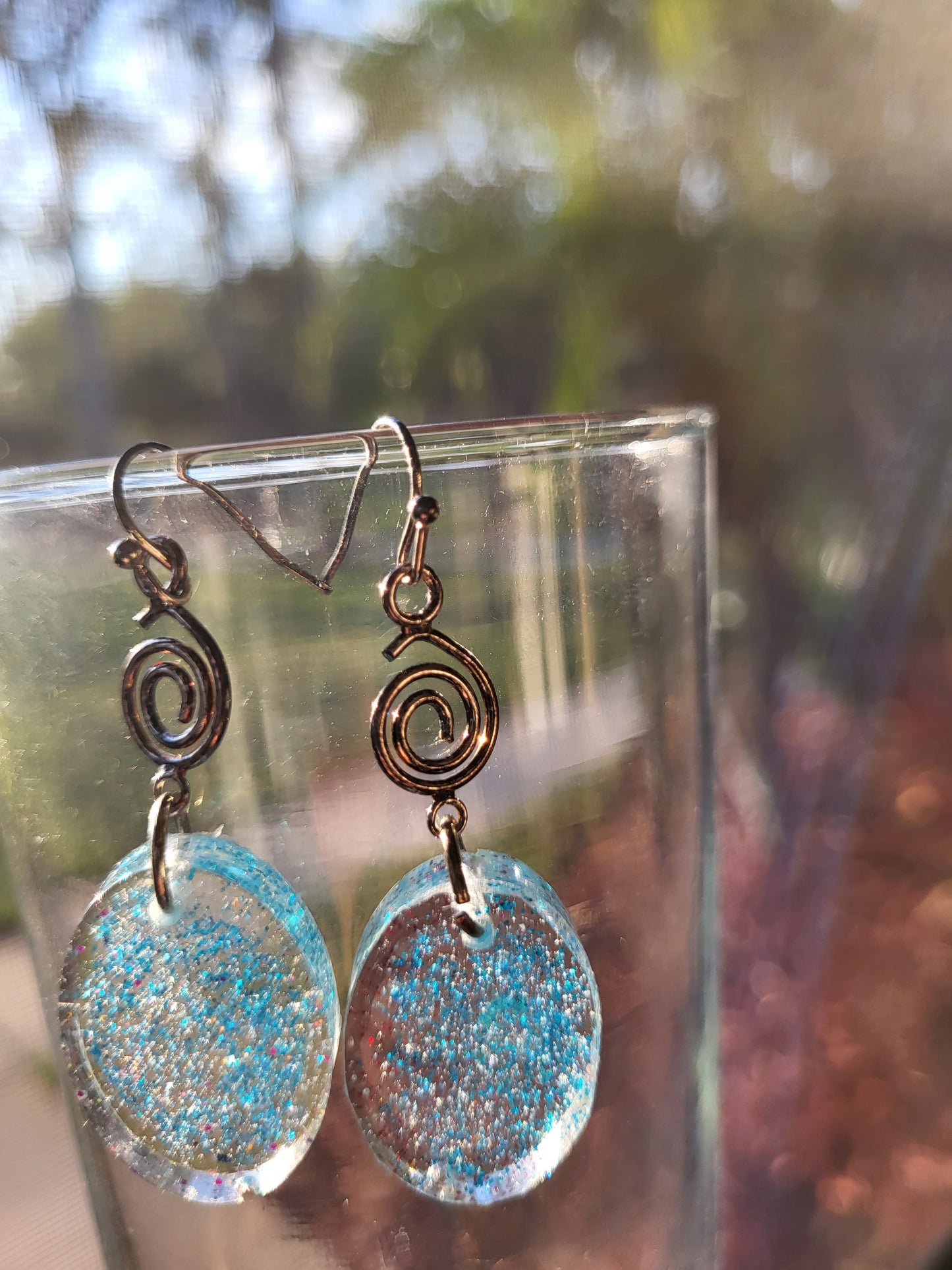 Blue Resin Oval Hook Earrings With Swirl Charm